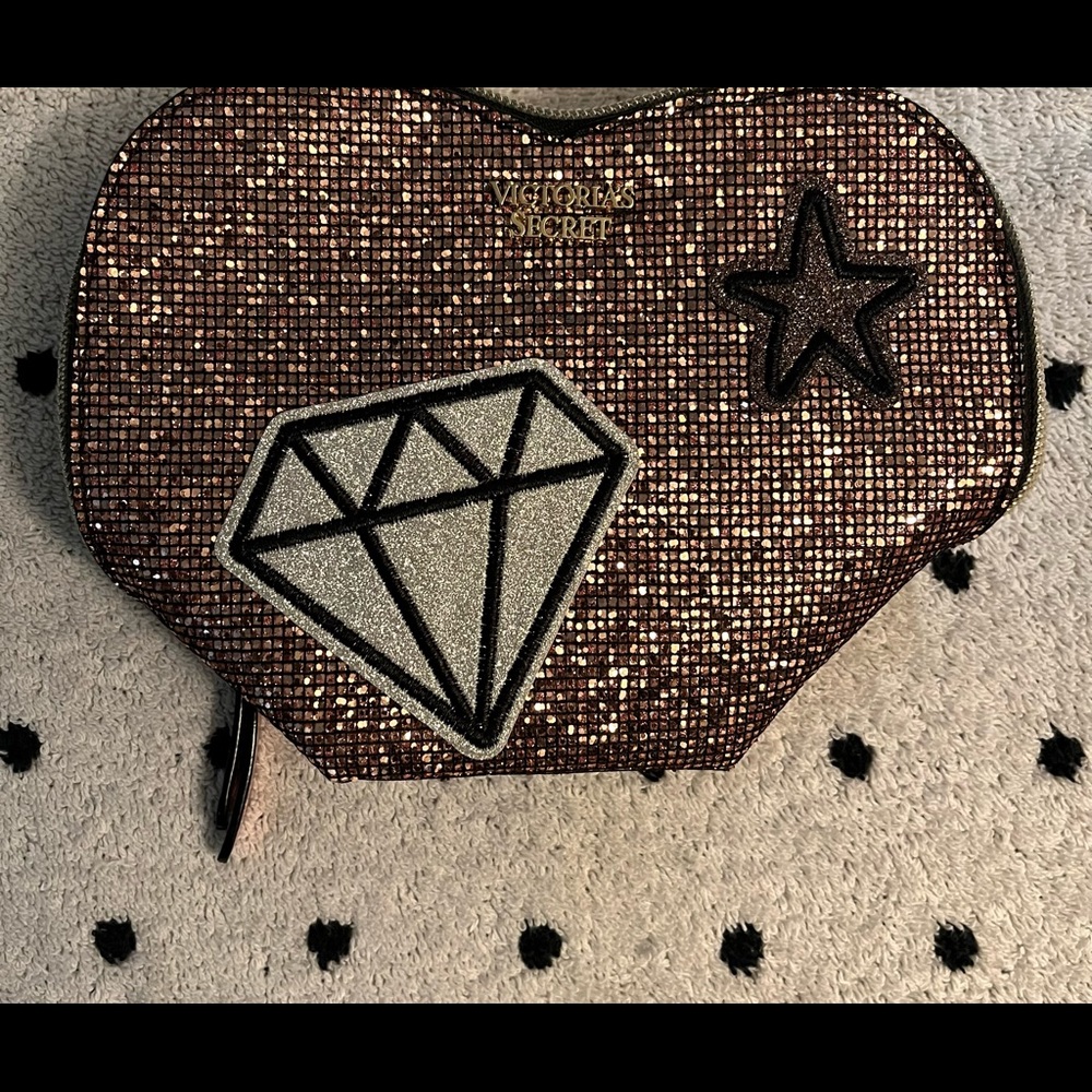 Victoria Secrets small cosmetic glitter bag.